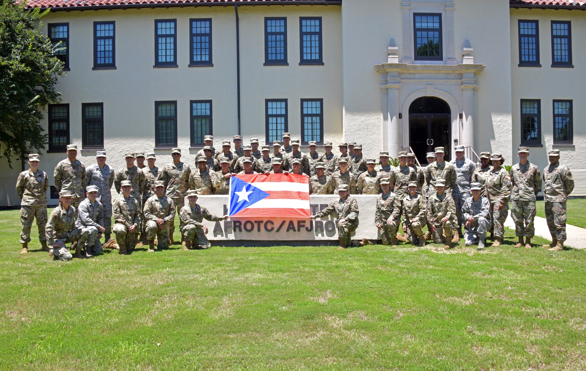 Cadets, participants of  the Puerto Rico Project Language program, pose for a group photo at Maxwell Air Force Base, Alabama, June 17, 2021. The PRPL is a four week program that was derived from the Defense Language Institute English Language Center program that provided U.S. Army trainees, who were permanent residents or U.S. citizens, with English-language training and cultural immersion. (U.S. Air Force photo by Senior Airman Rhonda Smith)