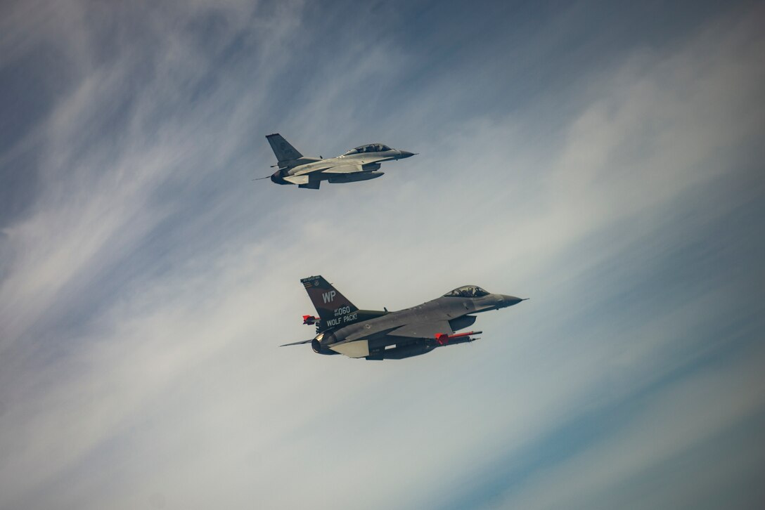 Two jets fly together.