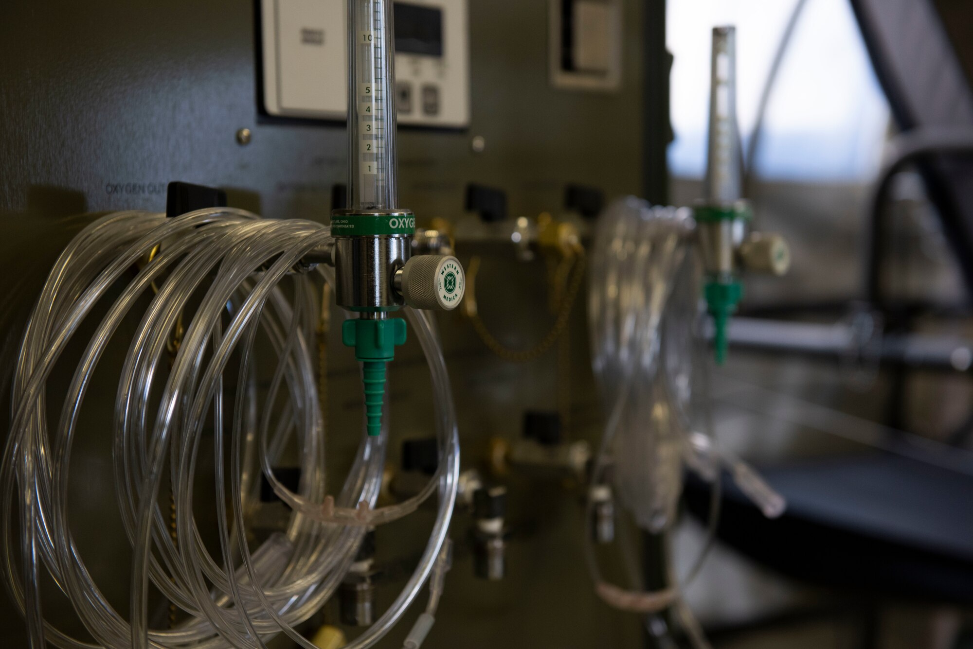 Soldiers from the 311th Field Hospital from Blacklick, Ohio, ready an oxygen machine to support patients during an Army field exercise at Yokota Air Base, Japan, June 25, 2021. During the exercise, the 311th Field Hospital from Blacklick, Ohio, constructed a 32-bed hospital and performed a variety of simulated procedures to include installing IVs, providing sutures and opening airways. (U.S. Air Force photo by Senior Airman Hannah Bean)