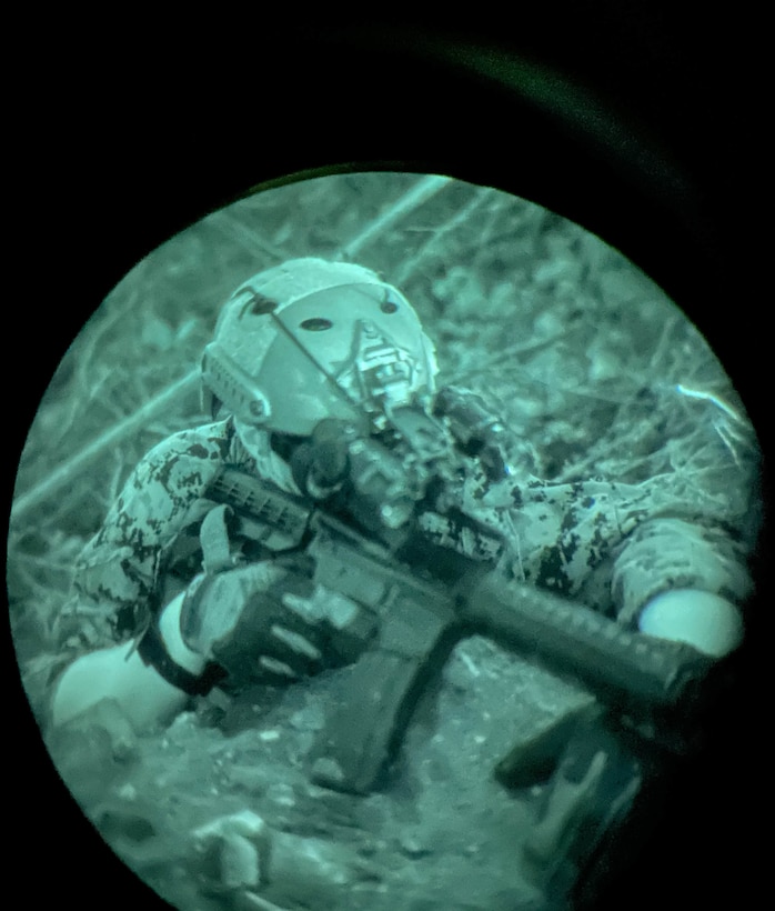 A U.S. Marines with 2d Reconnaissance Battalion (2d Recon), 2d Marine Division, participates in a night mission during Exercise Caribbean Coastal Warrior on Savaneta Kamp, Aruba, June 27, 2021. The exercise allows 2d Recon to expand its knowledge and proficiency when operating in littoral and coastal regions while increasing global interoperability with 32nd Raiding Squadron, Netherlands Marine Corps. (U.S. Marine Corps Lance Cpl. Jennifer E. Reyes)