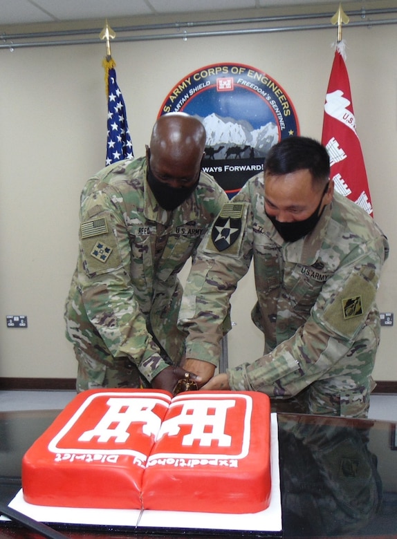 First “official” duty of the new command team of Reed and Tomagan was cutting the ceremonial cake following the Change of Responsibility, Change of Command ceremony on June 28, 2021 at Camp Arifjan, Kuwait. (Photo by Ce