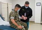 U.S. Navy Lieutenant Commander Douglas Weiss, who serves as an orthopedic surgeon at NMCCL is also a Team Physician for the men’s USA Hockey Team.