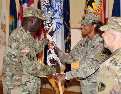 Col. Anthony “Tony” Nesbitt, U.S. Army Medical Logistics Command’s new commander, passes the colors back to Sgt. Maj. Danyell Walters during a change of command ceremony July 1 at Fort Detrick, Maryland. (Photo Credit: C.J. Lovelace)