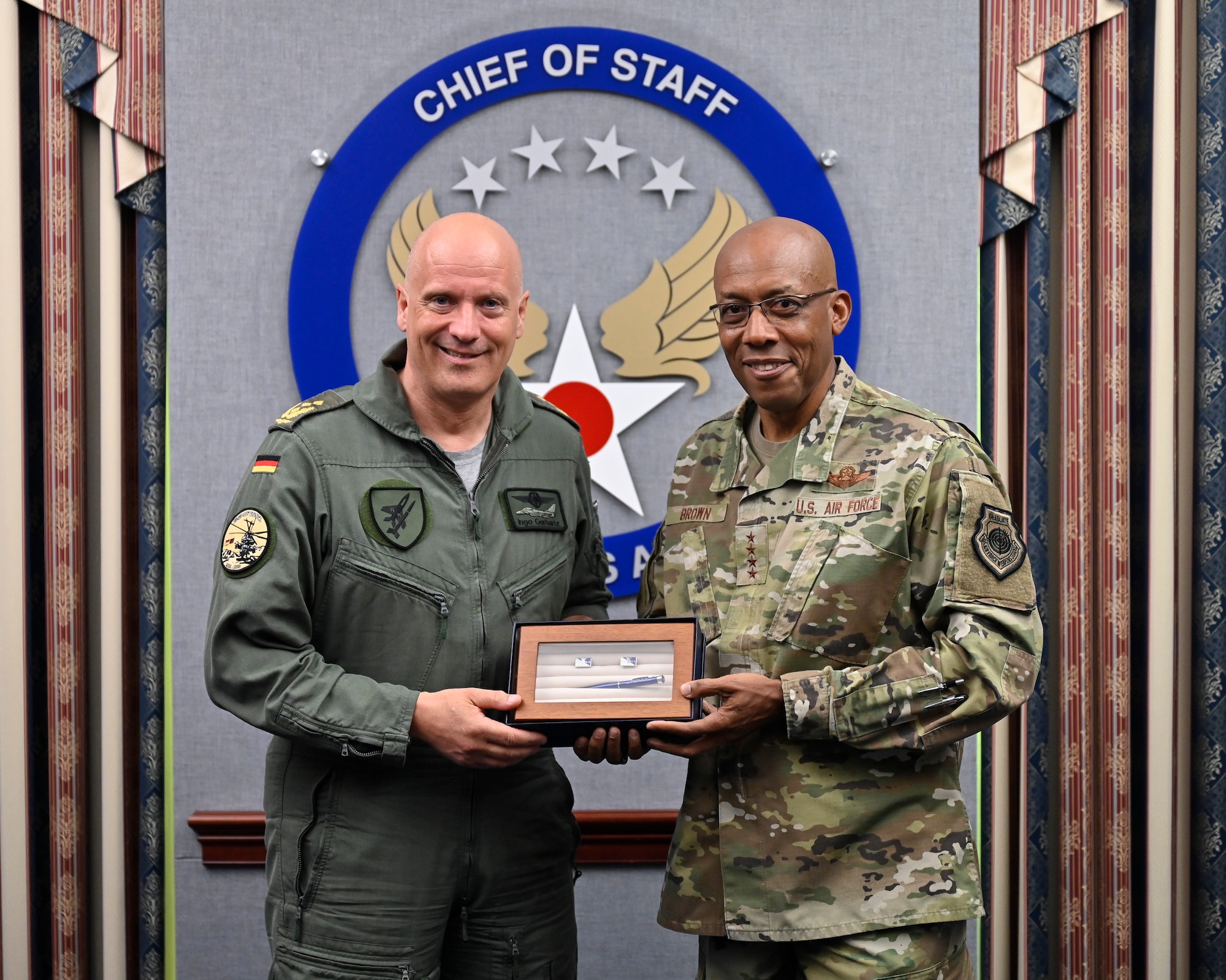 Air Force Chief of Staff Gen. CQ Brown, Jr. poses with Lt. Gen. Ingo Gerhartz, inspector of the German air force, after a meeting