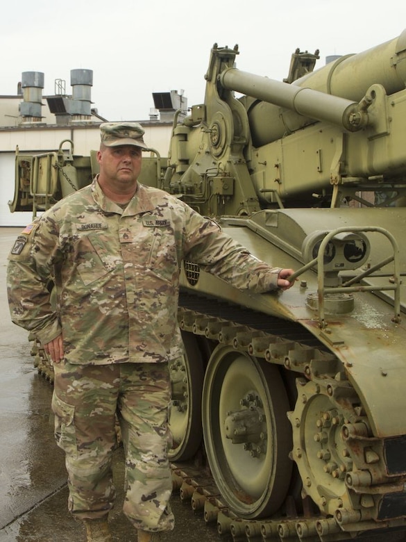 Staff Sgt. Edward Donahue stands beside a M110A2 Self-Propelled Howitzer