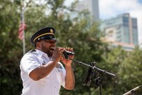 Staff Sgt. Randy Holmes, assigned to “Fort Sam’s Own” 323d Army Band, sings “God Bless the U.S.A.,” during an Independence Day concert held at The Alamo, July 2, 2021. The 323rd performed with the 313th Army Band, a U.S. Army Reserve band from Redstone Arsenal in Huntsville, Alabama. (U.S. Army Photo by Bethany Huff)