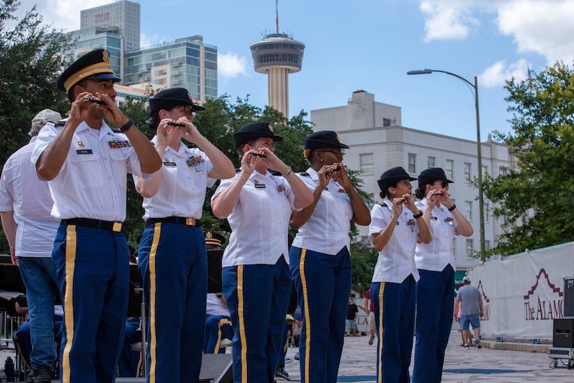 The piccolo section plays “Stars and Stripes Forever,” during an Independence Day concert held at The Alamo, July 2, 2021. “Fort Sam’s Own” 323d Army Band performed with the 313th Army Band, a U.S. Army Reserve band from Redstone Arsenal in Huntsville, Alabama. (U.S. Army Photo by Bethany Huff).