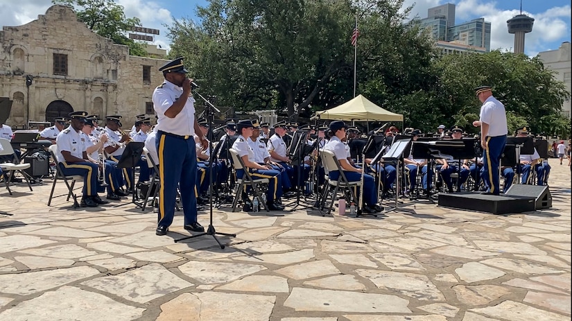 Staff Sgt. Randy Holmes, assigned to “Fort Sam’s Own” 323d Army Band, sings “God Bless the U.S.A.,” during an Independence Day concert held at The Alamo, July 2, 2021. The 323rd performed with the 313th Army Band, a U.S. Army Reserve band from Redstone Arsenal in Huntsville, Alabama. (U.S. Army Photo by Bethany Huff)