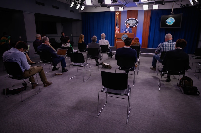 A man speaks to the press.