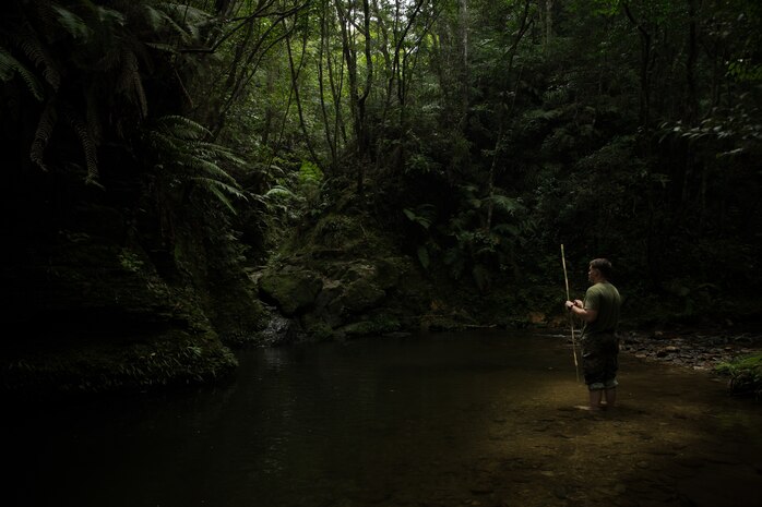 U.S. Marine Corps Staff Sgt. Michael Segul, an explosive ordnance disposal technician with EOD Company, 9th Engineer Support Battalion, 3rd Marine Logistics Group, fishes during Jungle Survival Training on Camp Gonsalves, Okinawa, Japan, June 8, 2021. EOD Marines support Expeditionary Advanced Base Operations by practicing survival methods in areas where logistical support may not be accessible, but mission completion is still the priority. 3rd MLG, based out of Okinawa, Japan, is a forward deployed combat unit that serves as III Marine Expeditionary Force’s comprehensive logistics and combat service support backbone for operations throughout the Indo-Pacific area of responsibility.