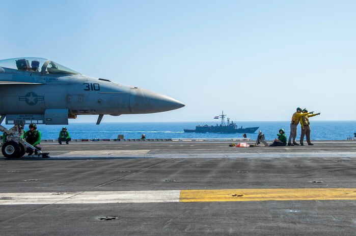 An F/A-18E Super Hornet fighter jet, attached to the "Wildcats" of Strike Fighter Squadron (VFA) 131, prepares to launch from the flight deck of aircraft carrier USS Dwight D. Eisenhower (CVN 69) as the ship conducts a passing exercise with Egyptian Navy guided-missile frigate ENS Taba (FFG 916) in the Red Sea, June 29. The Eisenhower Carrier Strike Group is deployed to the U.S. 5th Fleet area of operations in support of naval operations to ensure maritime stability and security in the Central Region, connecting the Mediterranean and Pacific through the western Indian Ocean and three strategic choke points.