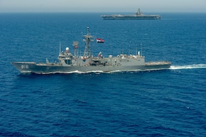Egyptian Navy guided-missile frigate ENS Taba (FFG 916), front, conducts a passing exercise with aircraft carrier USS Dwight D. Eisenhower (CVN 69) in the Red Sea, June 29. The Eisenhower Carrier Strike Group is deployed to the U.S. 5th Fleet area of operations in support of naval operations to ensure maritime stability and security in the Central Region, connecting the Mediterranean and Pacific through the western Indian Ocean and three strategic choke points.