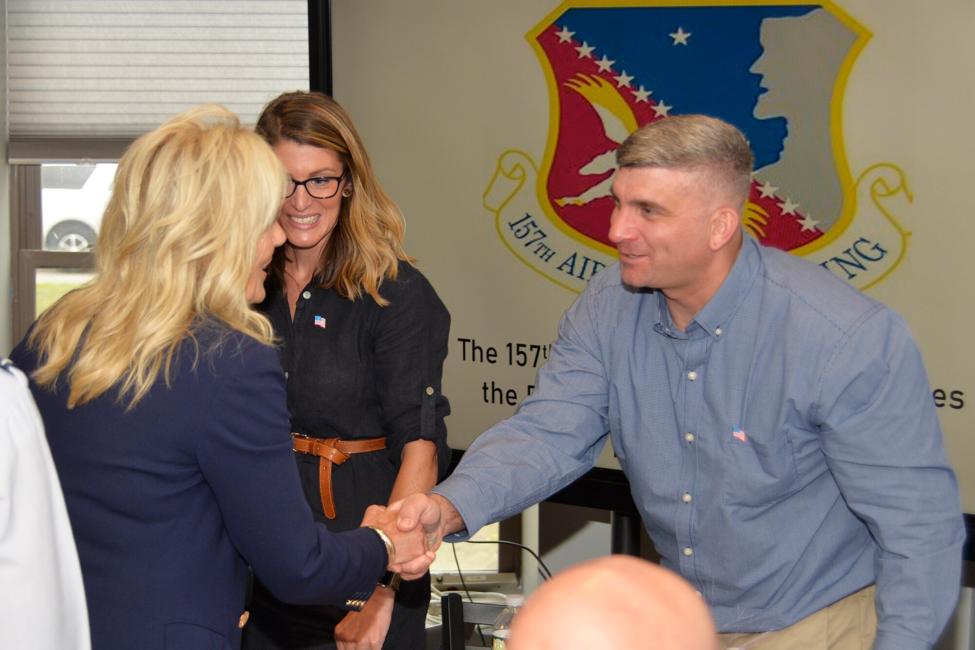 First Lady Dr. Jill Biden, left, shakes hands with U.S. Army Staff Sgt. Scott Auditore, New Hampshire Army National Guard 197th Field Artillery Brigade, while his wife, Danyelle looks on, Pease Air National Guard Base, July 3.