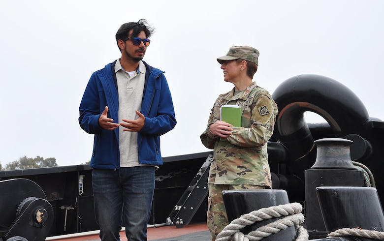 Col. Julie Balten, commander of the U.S. Army Corps of Engineers Los Angeles District, right, talks to Bobby Martinez, council member for the City of Port Hueneme, left, during a tugboat tour following a ribbon-cutting ceremony for the completion of the deepening of Port Hueneme Harbor June 28 at Port Hueneme, California.