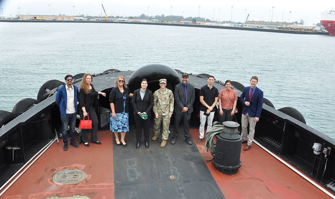 Col. Julie Balten, commander of the U.S. Army Corps of Engineers Los Angeles District, center, and David Van Dorpe, deputy district engineer for the Corps’ Los Angeles District, far right, pose for a picture with Port of Hueneme city and port officials during a tugboat tour following a ribbon-cutting ceremony celebrating the completion of the deepening of Port Hueneme Harbor June 28 at Port Hueneme, California.