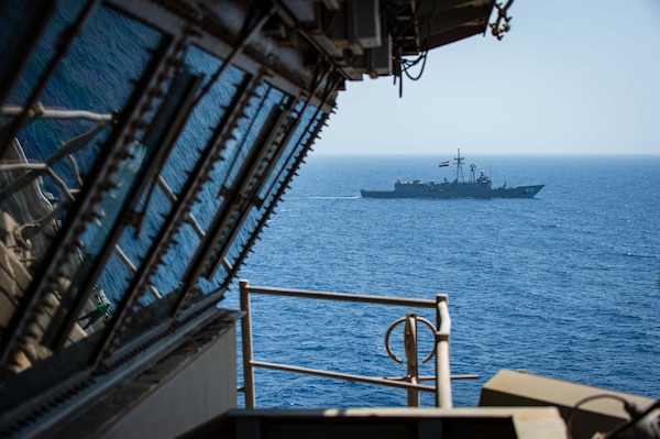 Egyptian Navy guided-missile frigate ENS Taba (FFG 916) and aircraft carrier USS Dwight D. Eisenhower (CVN 69) conduct a passing exercise in the Red Sea, June 29. The Eisenhower Carrier Strike Group is deployed to the U.S. 5th Fleet area of operations in support of naval operations to ensure maritime stability and security in the Central Region, connecting the Mediterranean and Pacific through the western Indian Ocean and three strategic choke points.