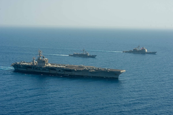 Aircraft carrier USS Dwight D. Eisenhower (CVN 69), left, Egyptian Navy guided-missile frigate ENS Taba (FFG 916), center, and guided-missile cruiser USS Vella Gulf (CG 72) conduct a passing exercise in the Red Sea, June 29. The Eisenhower Carrier Strike Group is deployed to the U.S. 5th Fleet area of operations in support of naval operations to ensure maritime stability and security in the Central Region, connecting the Mediterranean and Pacific through the western Indian Ocean and three strategic choke points.