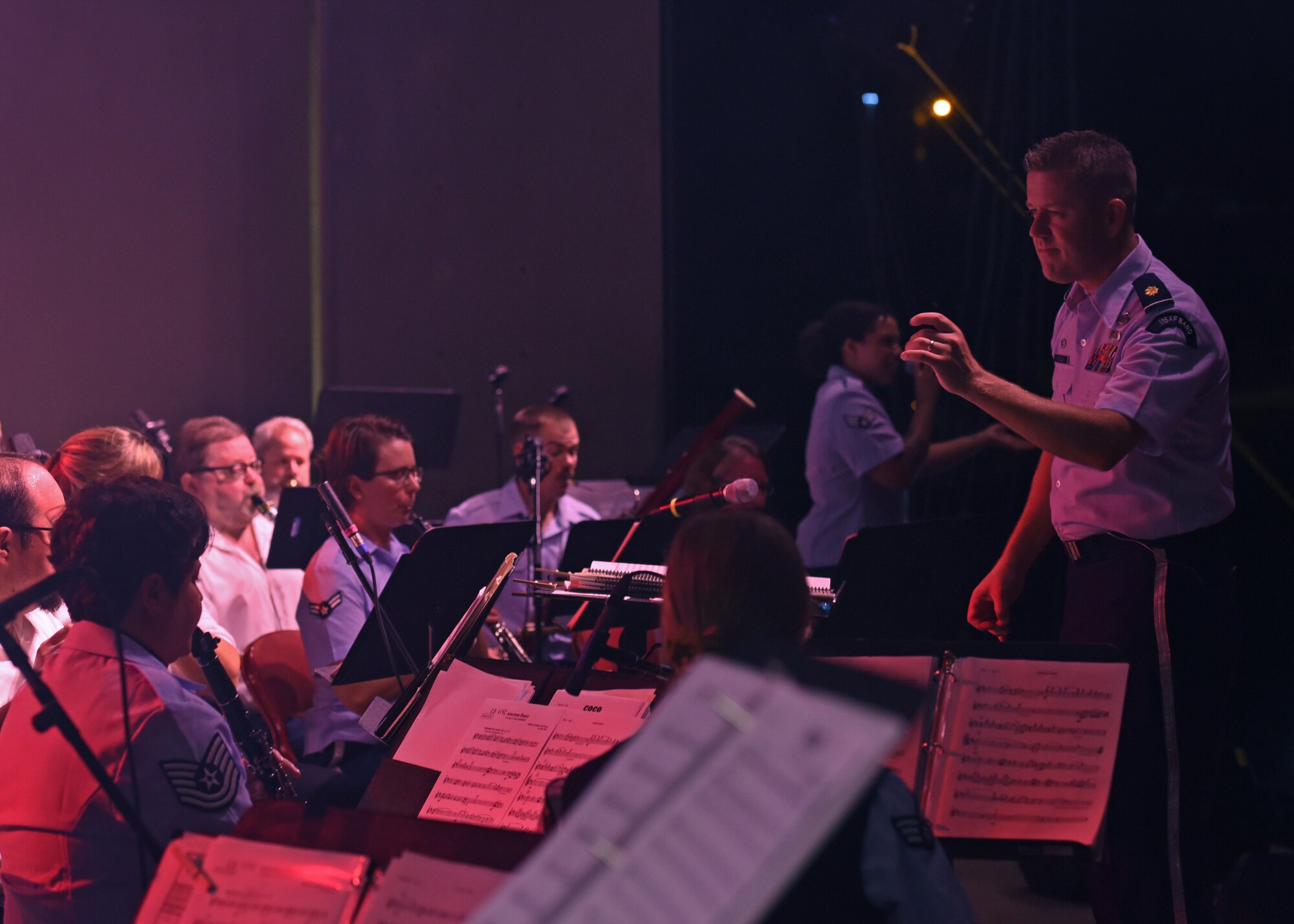 U.S. Air Force Maj. Dustin Doyle, United States Air Force Band of the West commander and conductor assigned to Joint Base San Antonio-Lackland, Texas, directs the Star-Spangled Banner Concert and Fireworks show, at the Bill Aylor Sr. Memorial RiverStage in San Angelo, Texas, July 3, 2021. This was the first live community outreach for the USAF Band of the West since March of 2020. (U.S. Air Force photo by Senior Airman Abbey Rieves)