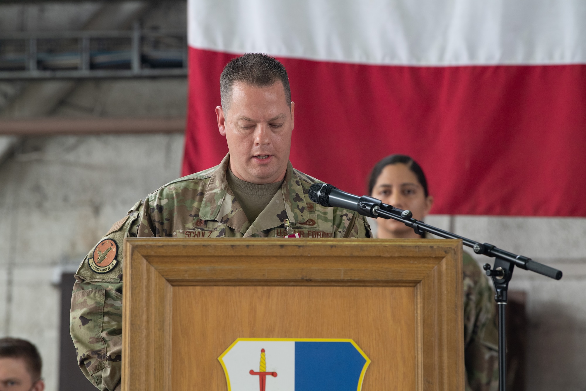 U.S. Air Force Lt. Col. Shawn Schulz, outgoing 52nd Comptroller Squadron commander, addresses the crowd at his change of command ceremony at Spangdahlem Air Base, Germany, June 30, 2021. Schulz has been the commander of the 52nd CPTS since 2018. (U.S. Air Force photo by Senior Airman Ali Stewart)