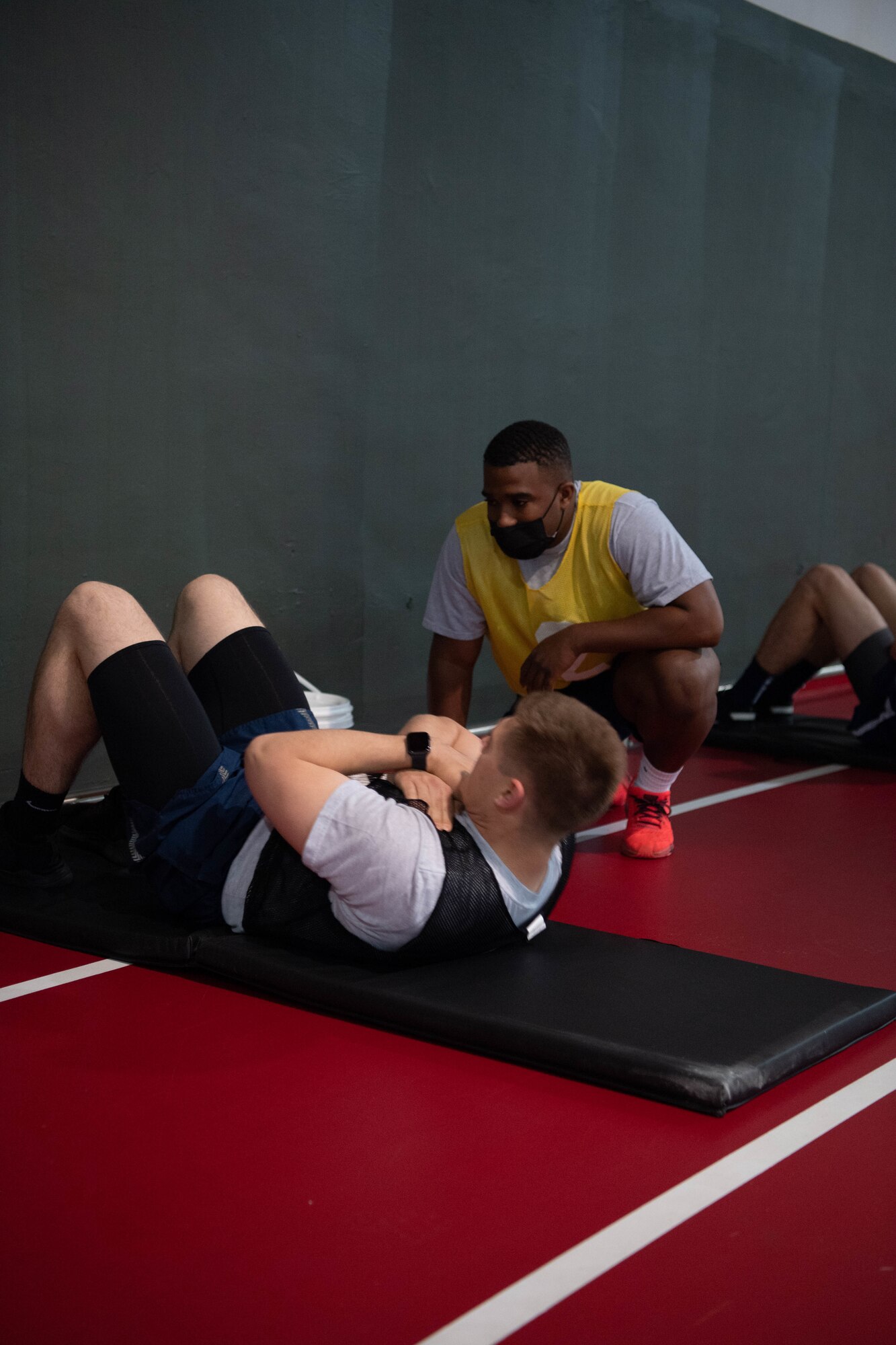 Airman does sit-ups.