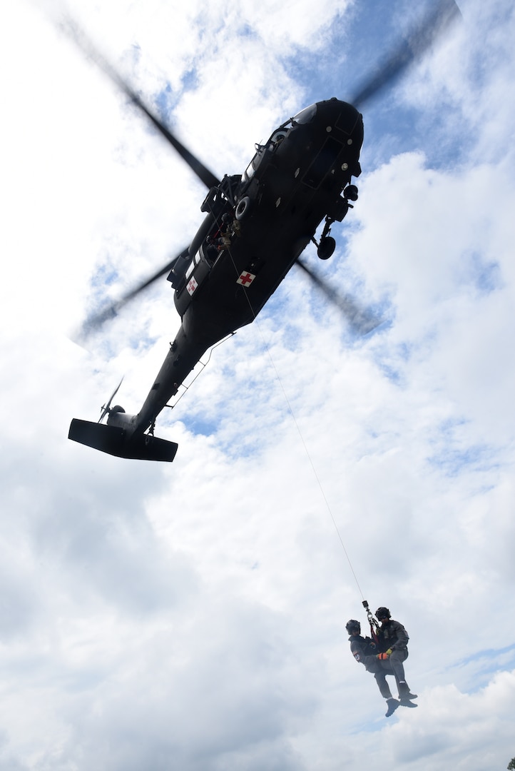 Virginia National Guard aviation crews and Chesterfield County Fire and Emergency Medical Services Scuba Rescue Team members train on confined-space rescue hoist operations June 10, 2021, in Chesterfield County, Virginia. During quarterly training, the team practiced rescue hoists from rooftops, balconies and vehicles.