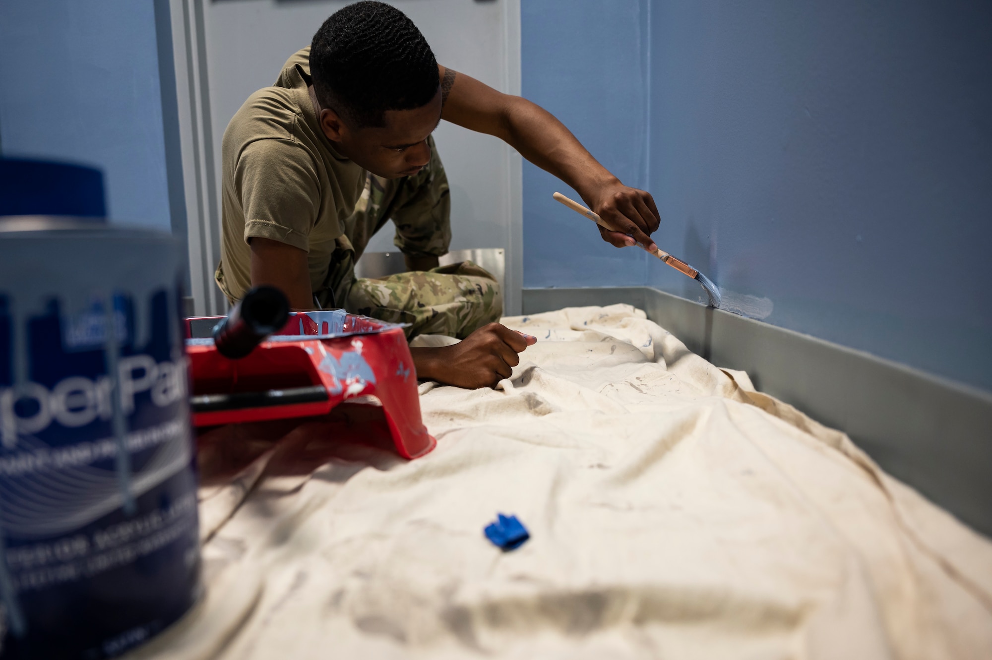 Staff Sgt. Terique Howard, 911th Civil Engineering Squadron structures technician, paints a wall in the headquarters building at the Pittsburgh International Airport Air Reserve Station, Pennsylvania, June 9, 2021.