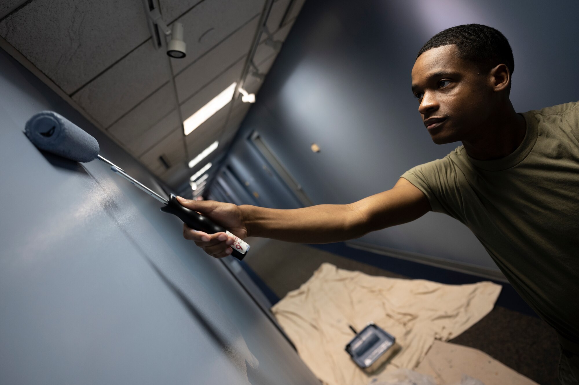 Staff Sgt. Terique Howard, 911th Civil Engineering Squadron structures technician, paints a wall in the headquarters building at the Pittsburgh International Airport Air Reserve Station, Pennsylvania, June 9, 2021.