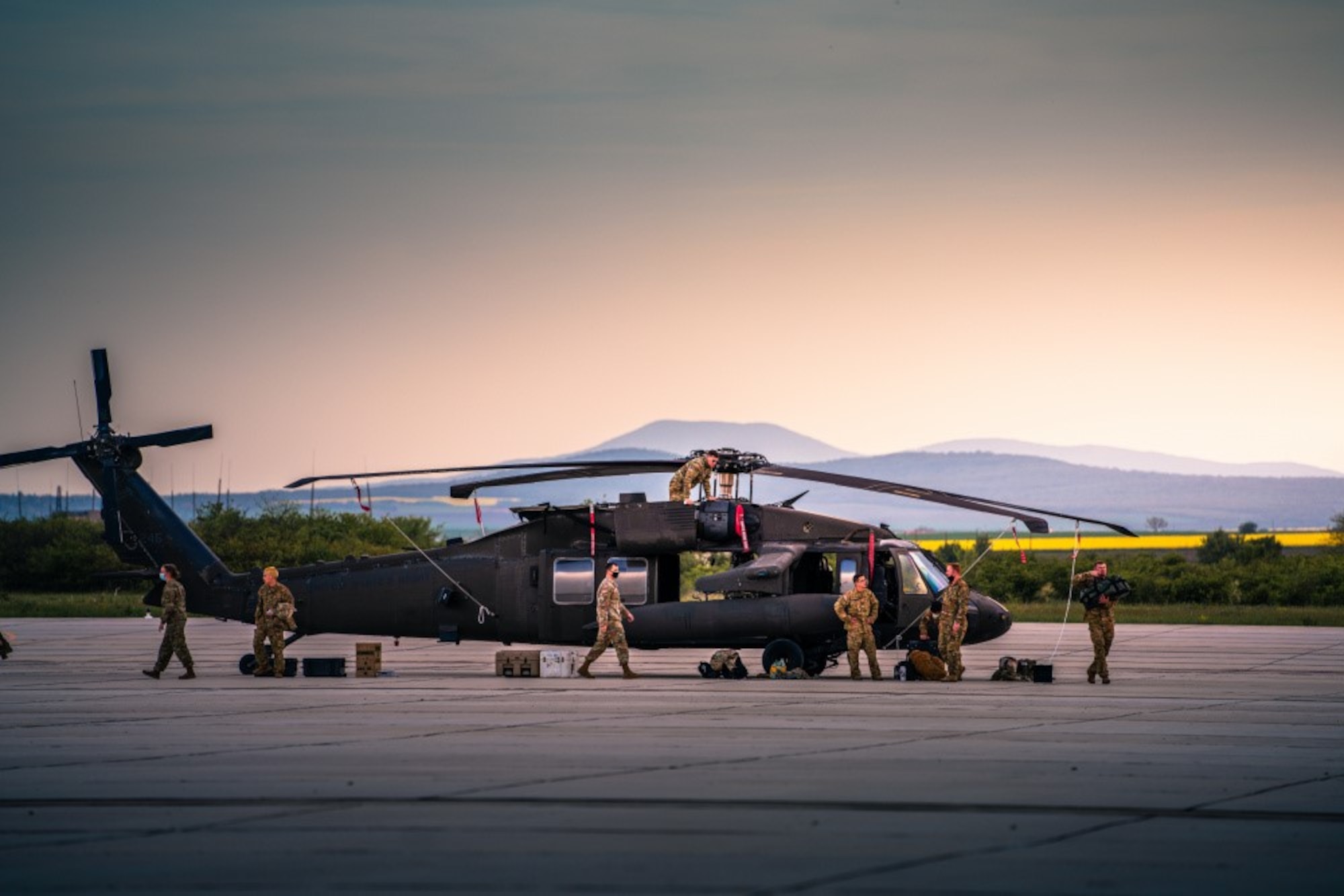 UH-60 crews from 1st Battalion, 214th Aviation Regiment unload their Blackhawks after arriving at Bezmer Airfield, Bulgaria, on April 30, 2021, for Exercise Swift Response, part of DEFENDER-Europe 21. 12th Combat Aviation Brigade demonstrated its ability to rapidly project aviation assets from their home bases in Germany to Eastern Europe by deploying 17 aircraft, crossing seven countries in under 12 hours. (U.S. Army photo by Maj. Robert Fellingham.)