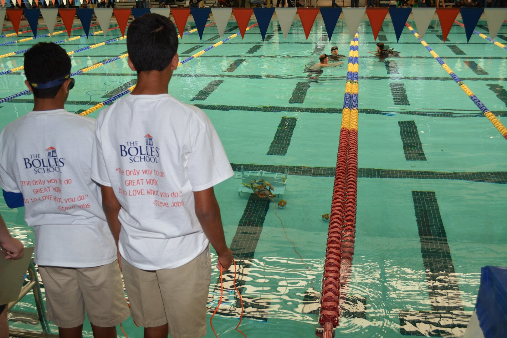 Middle school students from Bolles Middle School operate their SeaPerch remotely operated vehicle (ROV) in the regional SeaPerch competition held in Jacksonville, Fla. Divers from Southeast Regional Maintenance Center (SERMC) volunteered to assist with the competition, pictured in the background. SERMC’s STEM outreach program includes 35 schools and supports over 500 students every year.