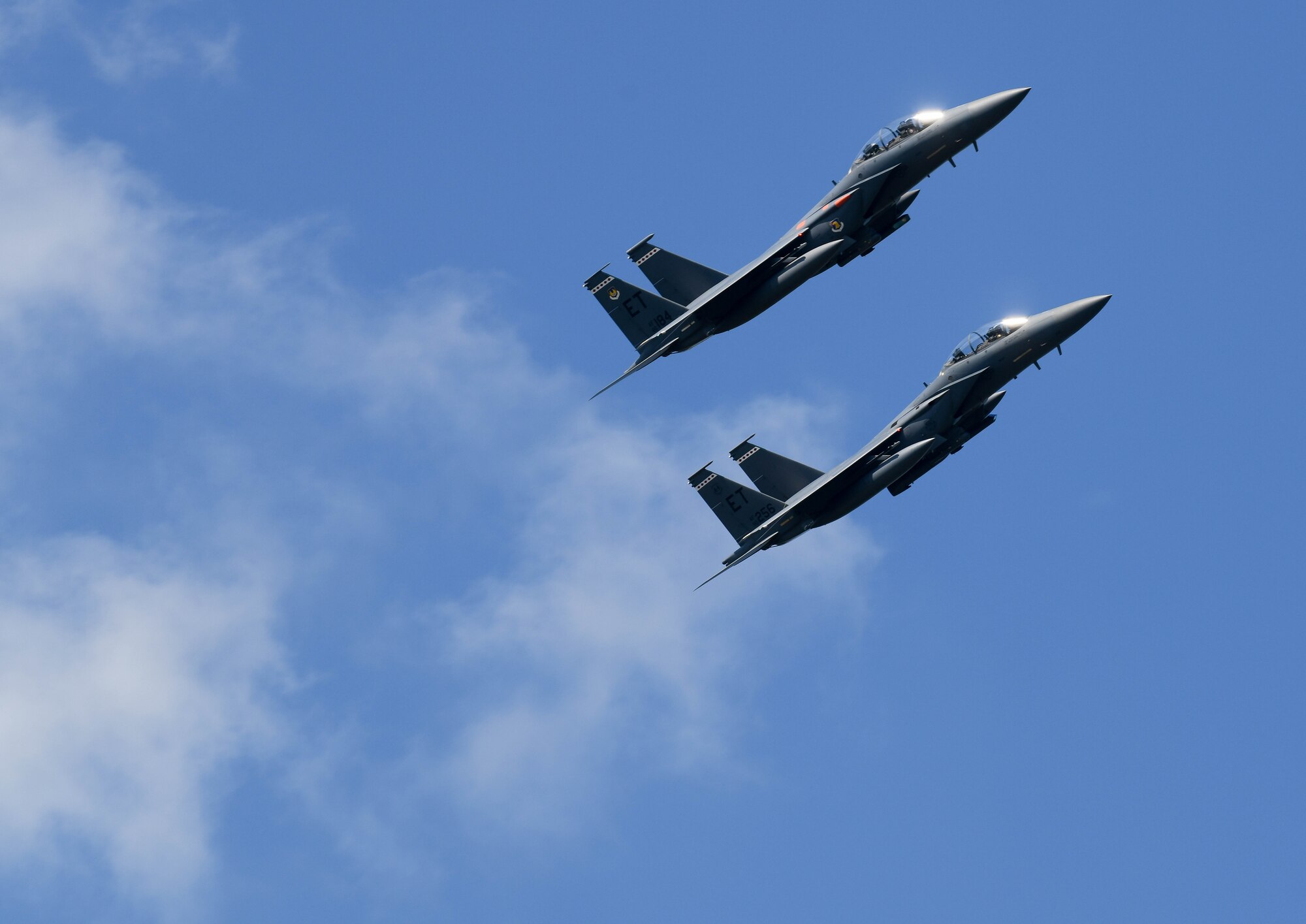 A pair of F-15 Eagles from the 96th Test Wing out of Eglin Air Force Base, Florida, fly over Arnold Air Force Base during a retreat ceremony after the Arnold Engineering Development Complex “Hap Arnold Day” 70th Anniversary Celebration Open House, June 26, 2021, at Arnold AFB, Tenn. (U.S. Air Force photo by Jill Pickett)