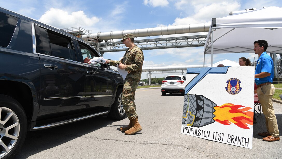 2nd Lt. Paul McCormack hands out information about the Propulsion Test Branch, Test Division, Arnold Engineering Development Complex, during the AEDC “Hap Arnold Day” 70th Anniversary Celebration Open House, June 26, 2021, at Arnold Air Force Base, Tenn. (U.S. Air Force photo by Jill Pickett)