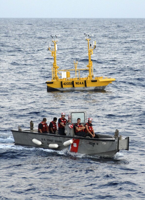 People float in a small boat.