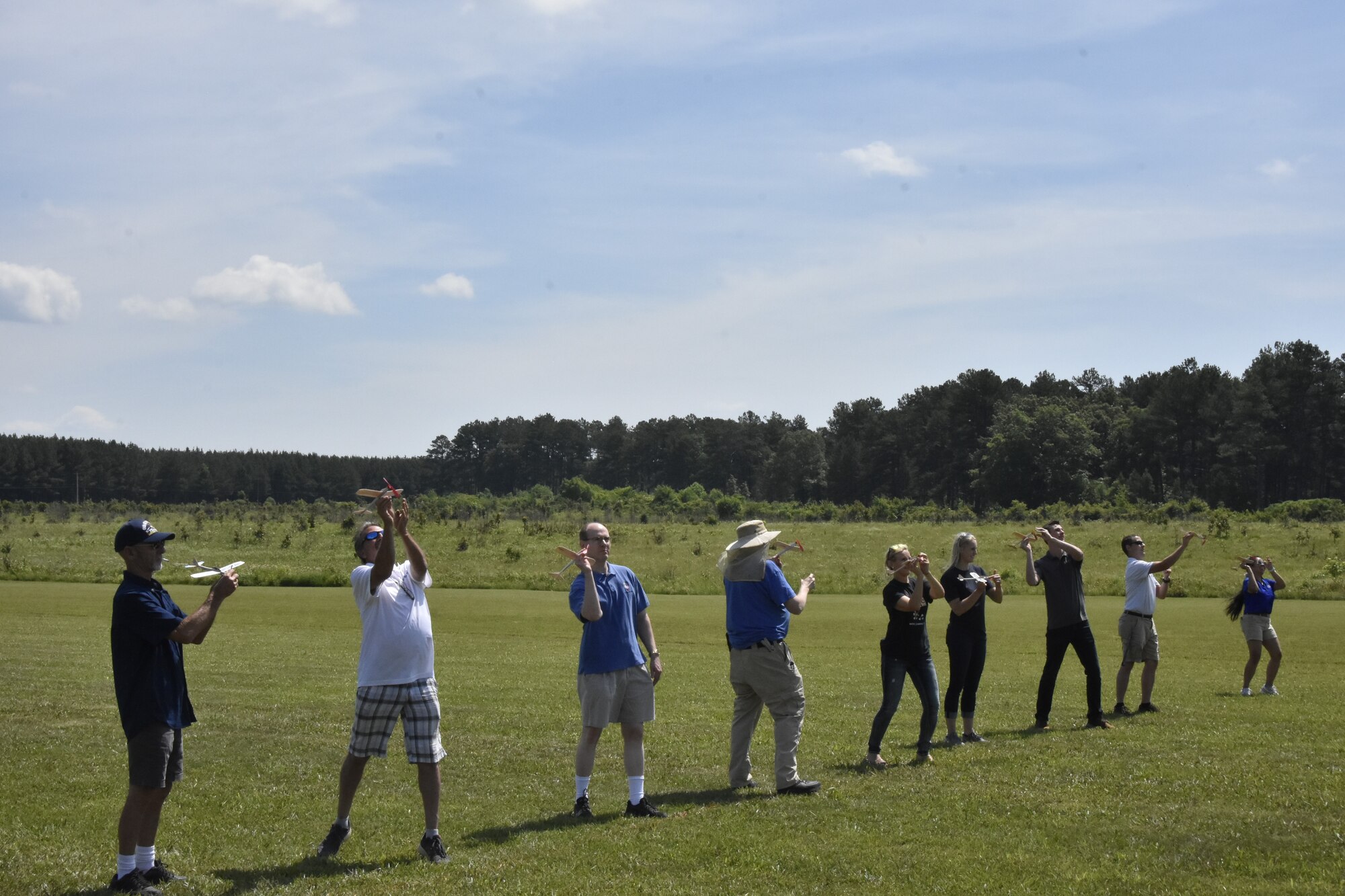 Members of the Coffee Airfoilers Model RC Club and volunteers give the balsa wood airplanes they assembled a toss during a June 26, 2021, event hosted by the club to coincide with the Arnold Engineering Development Complex 70th anniversary celebration. (U.S. Air Force photo by Bradley Hicks)