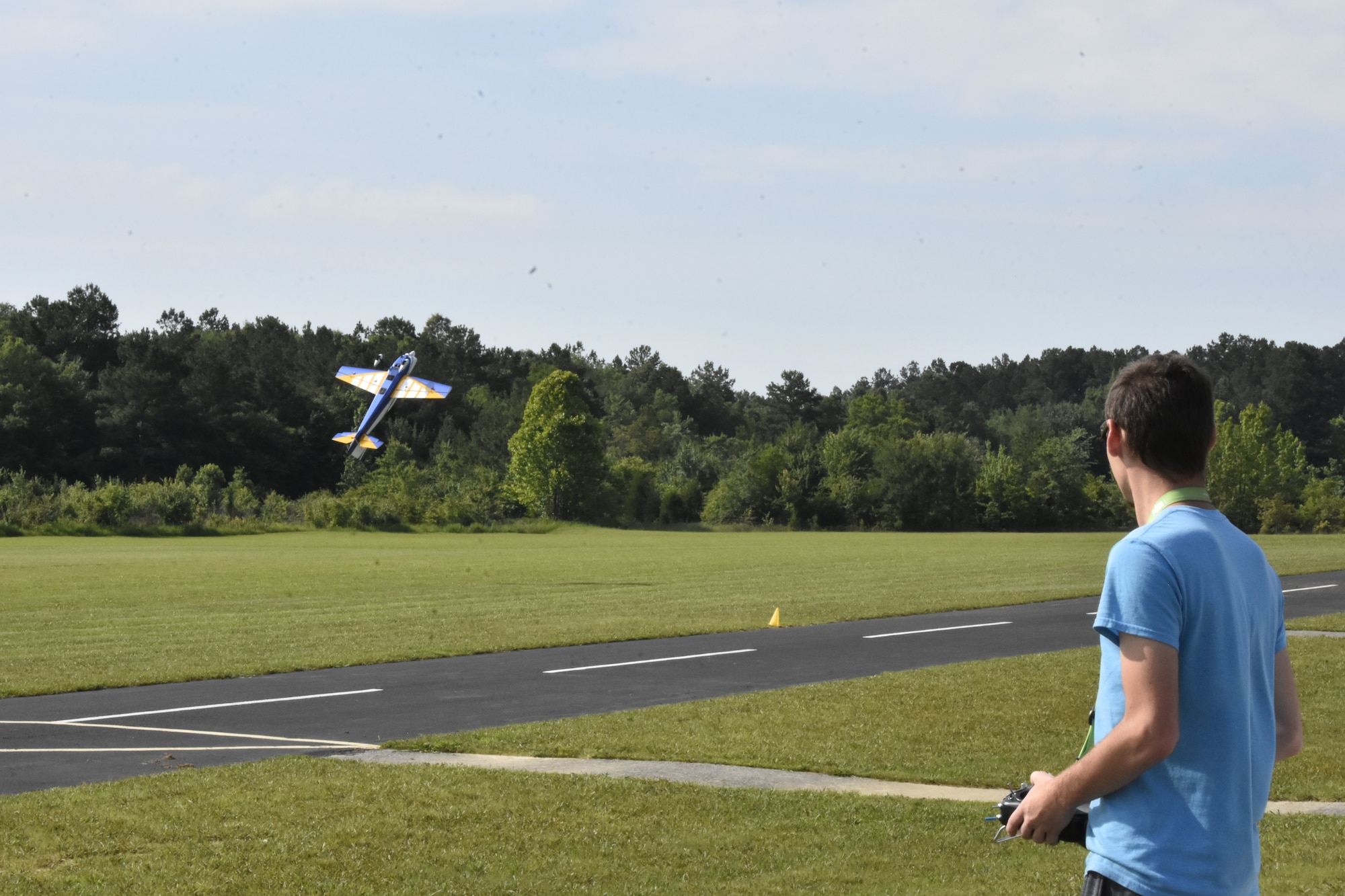 Nicholas Amelang puts on an RC aerobatics demonstration during a June 26, 2021, event hosted by the Coffee Airfoilers Model RC Club to coincide with the Arnold Engineering Development Complex 70th anniversary celebration at Arnold Air Force Base, Tenn. (U.S. Air Force photo by Bradley Hicks)