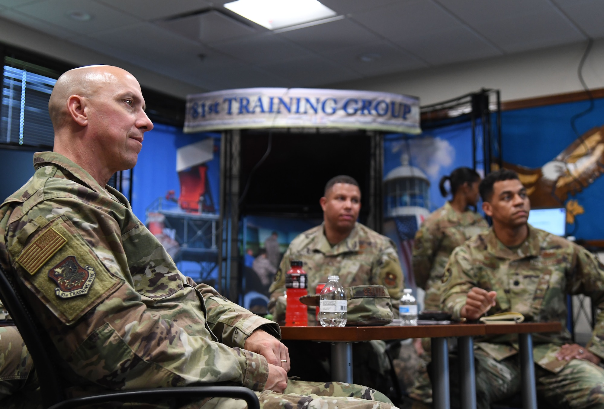 U.S. Air Force Col. William Hunter, 81st Training Wing commander, attends an 81st Training Support Squadron briefing inside the Trainer Development Center during an 81st Training Group immersion tour at Keesler Air Force Base, Mississippi, June 22, 2021. The purpose of the tour was to become more familiar with Keesler's mission. (U.S. Air Force photo by Kemberly Groue)