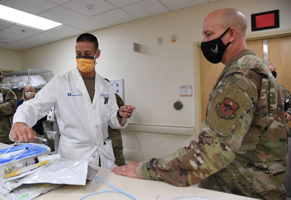 U.S. Air Force Maj. David Russo, 81st Healthcare Operations Squadron interventional cardiologist, shows catheterization lab equipment to Col. William Hunter, 81st Training Wing commander, during an 81st Medical Group tour at Keesler Air Force Base, Mississippi, June 29, 2021. The purpose of the tour was to become more familiar with Keesler's mission. (U.S. Air Force photo by Kemberly Groue)