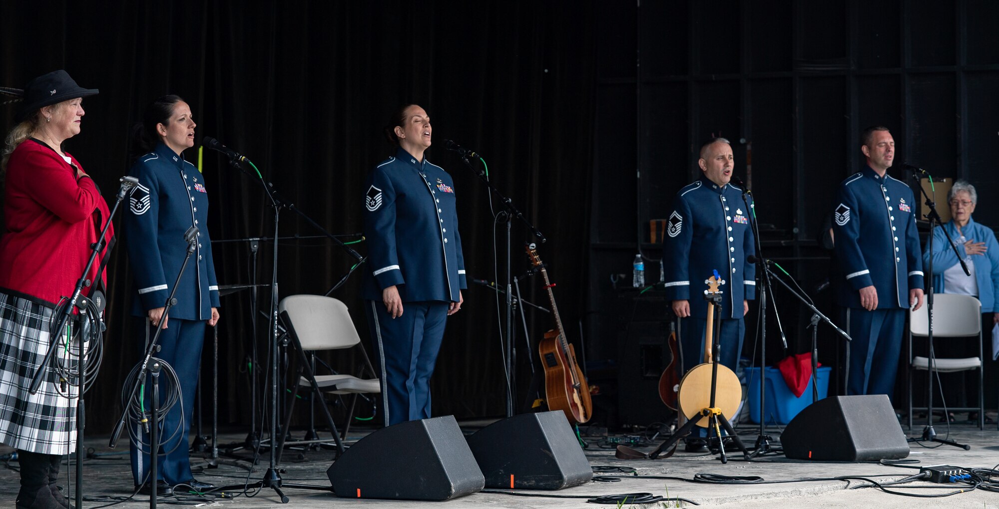 The U.S. Air Force Band ensemble Celtic Aire performs an acapella rendition of the national anthem at the Alaska Scottish Highland Games opening ceremony in Palmer, Alaska, June 26, 2021.