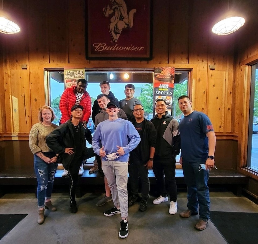 Classmates from ALS Class 21-4 gather to celebrate their graduation from the course at Logan's Steakhouse in Sumter, S.C. on May 12, 2021. Airman Leadership School prepares service members and civilians  to become team leaders and frontline supervisors that help better our military.