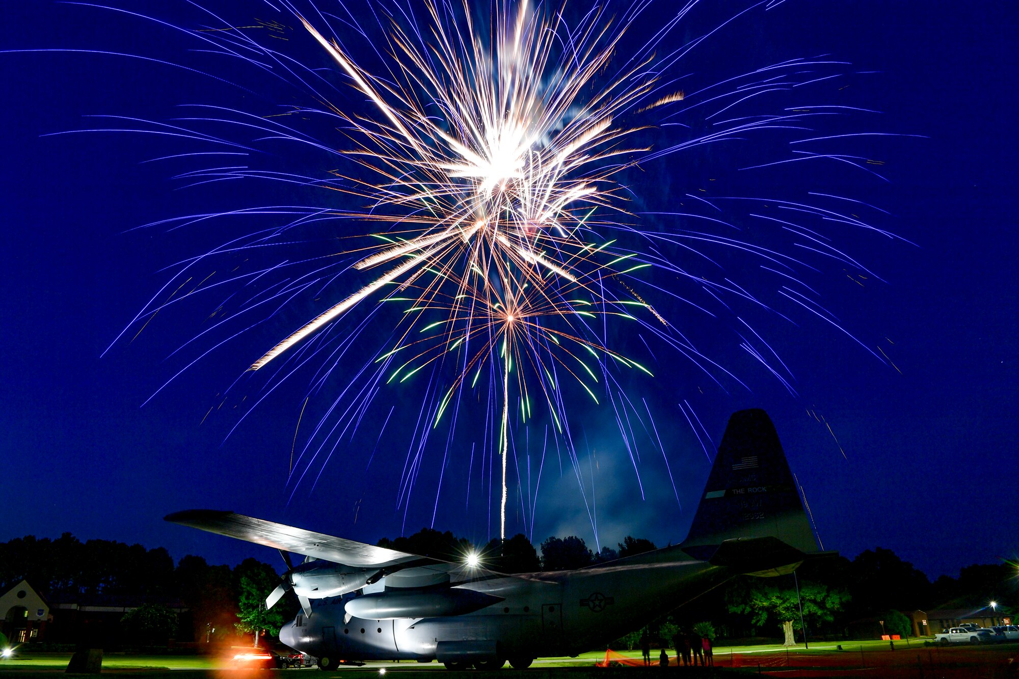 Fireworks light up the sky over a C-130H at Heritage Park