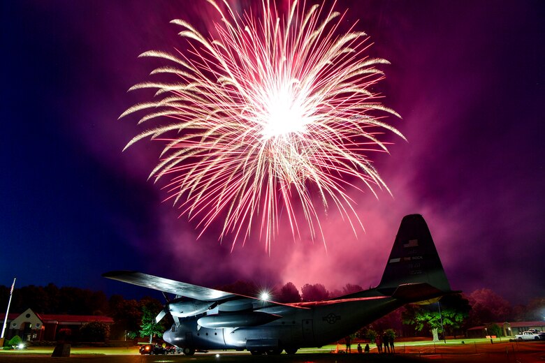 Fireworks light up the sky over a C-130H at Heritage Park