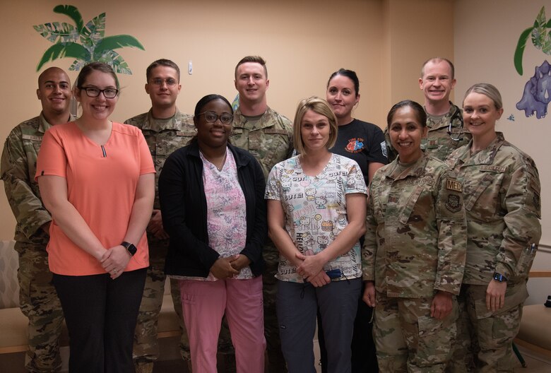 The 375th Health Care Operations Squadron Pediatrics Clinic team pose for a photo, on Scott Air Force Base, Illinois, June 23, 2021. The 375th Pediatric Clinic team has continued to provide patients with the best care available. (U.S. Air Force photo by Airman 1st Class Stephanie Henry)