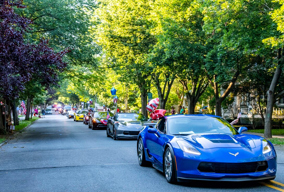 A line of Corvettes drive in the annual Fourth of July Celebration parade in Dover, Delaware, July 4, 2021. The celebration also included a reading of the Declaration of Independence, tours of the Old State House, musical entertainment and a fireworks display. (U.S. Air Force photo by Senior Airman Stephani Barge)