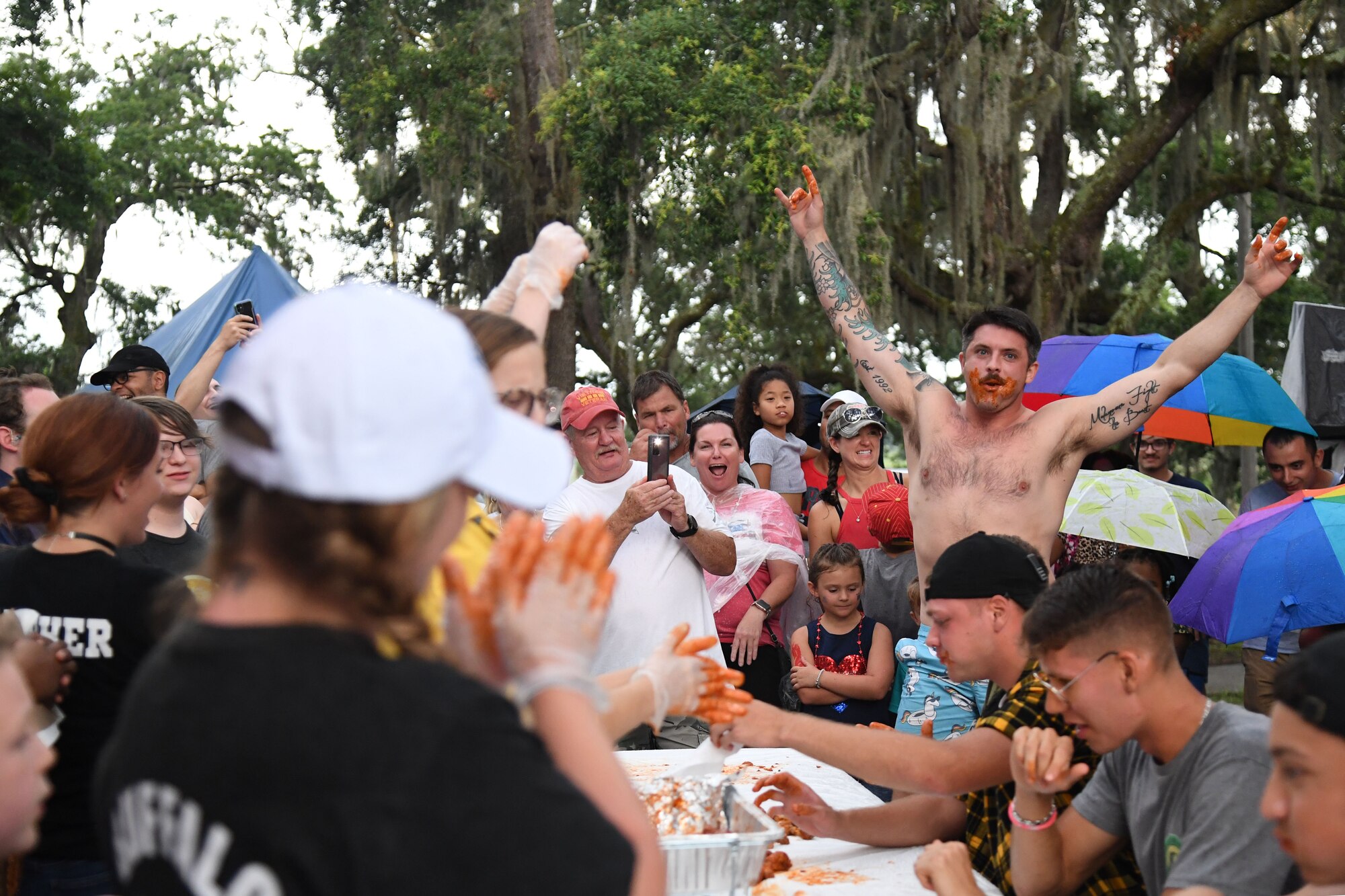 U.S. Air Force Airman Basic Zach Updegraff, 336th Training Squadron student, participates in a wing eating contest during Freedom Fest at Marina Park at Keesler Air Force Base, Mississippi, July 2, 2021. The event also included hot dogs and watermelon eating competitions and fireworks. (U.S. Air Force photo by Kemberly Groue)