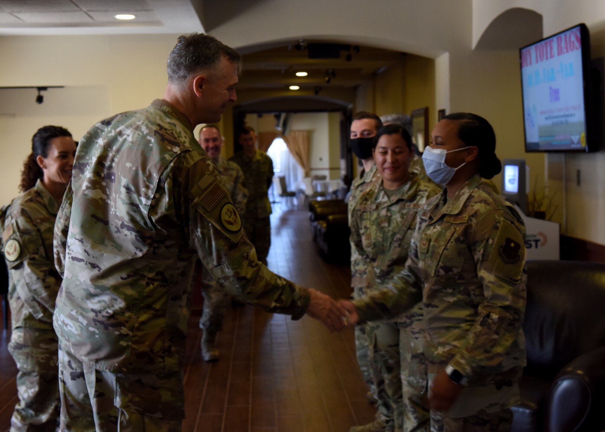 U.S. Air Force Maj. Gen. Craig Wills, left, 19th Air Force commander, recognizes Airmen assigned to the 56th Medical Group during a base visit, June 28, 2021, at Luke Air Force Base, Arizona. Leadership from the 19th AF visited Luke AFB to engage with 56th Fighter Wing members while gaining a better understanding of the successes and challenges faced by the wing. The 56th FW’s mission is to train the world’s greatest fighter pilots and combat-ready Airmen. (U.S. Air Force photo by Tech. Sgt. Franklin R. Ramos)