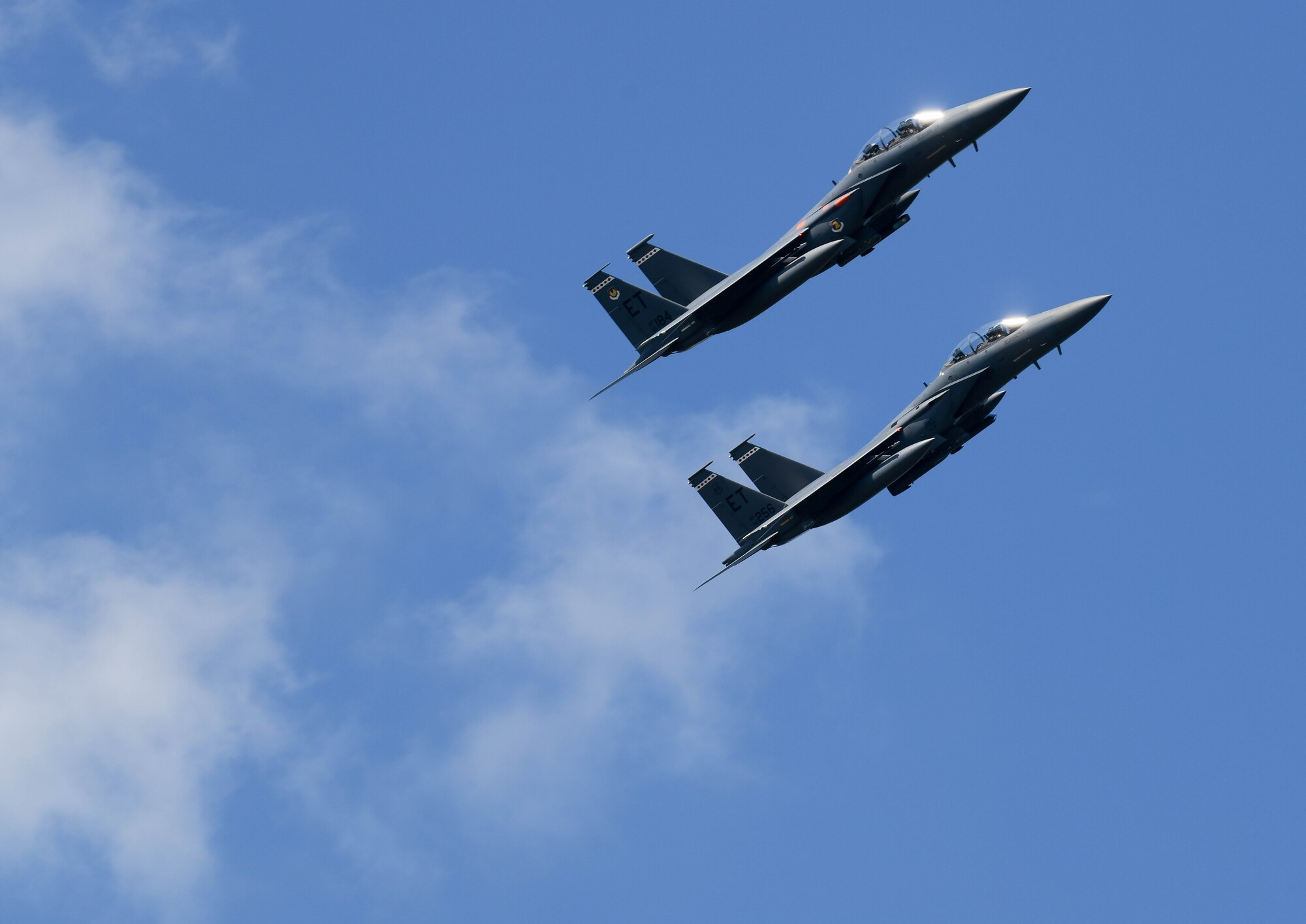 A pair of F-15 Eagles from the 96th Test Wing out of Eglin Air Force Base, Florida, fly over Arnold Air Force Base during a retreat ceremony after the Arnold Engineering Development Complex “Hap Arnold Day” 70th Anniversary Celebration Open House, June 26, 2021, at Arnold AFB, Tenn. (U.S. Air Force photo by Jill Pickett)