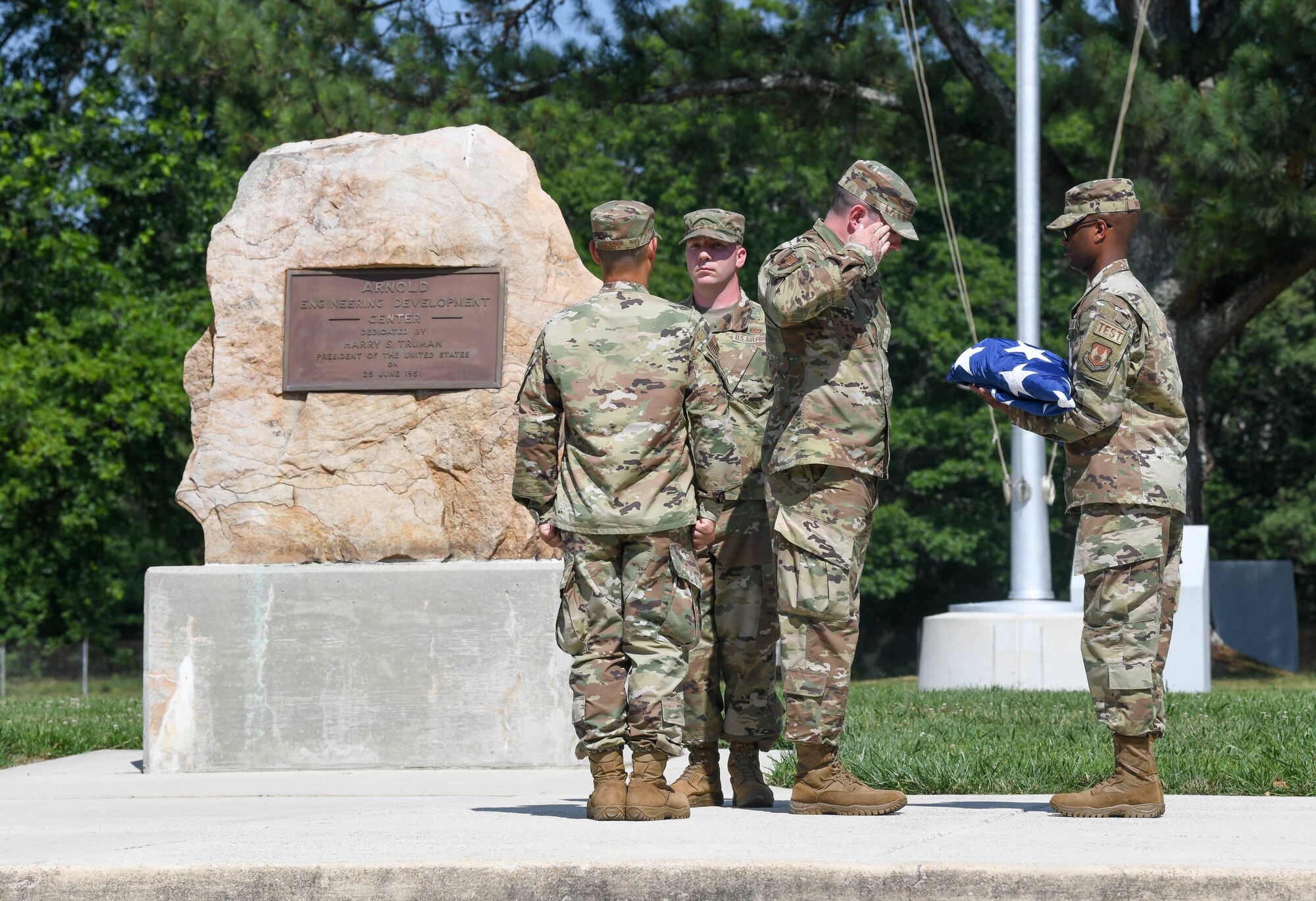 A detail of Airmen of the Arnold Engineering Development Complex fold the U.S. flag during a retreat ceremony after the AEDC “Hap Arnold Day” 70th Anniversary Celebration Open House, June 26, 2021, at Arnold Air Force Base, Tenn. (U.S. Air Force photo by Jill Pickett)