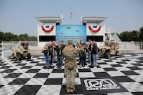 Brig. Gen. Ernest Litynski, Commanding General, 85th U.S. Army Reserve Support Command, swears in future Soldiers, in the Winner’s Circle, during the Fourth of July NASCAR Cup Series race at Road America, Elkhart Lake, Wisconsin, July 4, 2021.