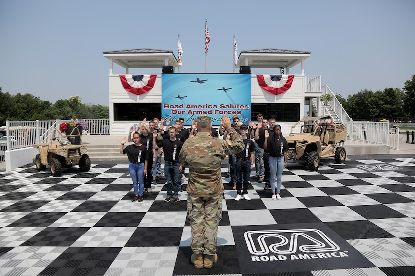 Brig. Gen. Ernest Litynski, Commanding General, 85th U.S. Army Reserve Support Command, swears in future Soldiers, in the Winner’s Circle, during the Fourth of July NASCAR Cup Series race at Road America, Elkhart Lake, Wisconsin, July 4, 2021.