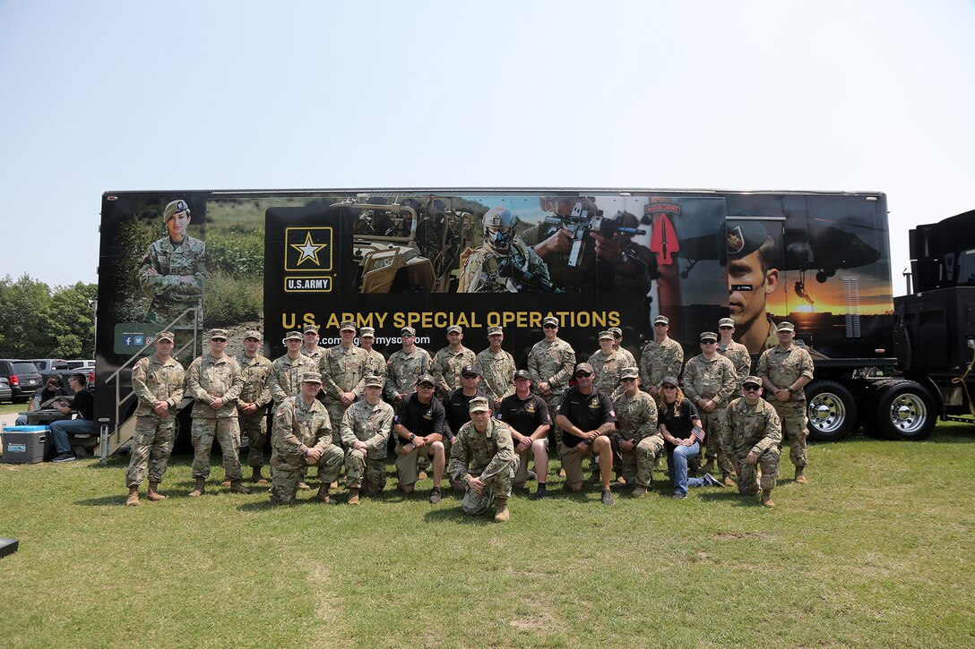 Brig. Gen. Ernest Litynski, center front, Commanding General, 85th U.S. Army Reserve Support Command, pauses for a photo with Soldiers from the U.S. Army Recruiting Battalion-Milwaukee and Appleton Recruiting Company during the Fourth of July NASCAR Cup Series race at Road America, Elkhart Lake, Wisconsin, July 4, 2021.