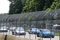 The pace car leads drivers in the initial lap across a four-mile track during the Fourth of July NASCAR Cup Series race at Road America, Elkhart Lake, Wisconsin, July 4, 2021.